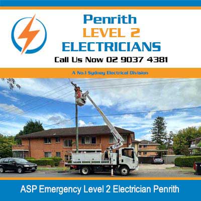 Emergency utility truck with boom lift elevated near power pole at residential area in Penrith